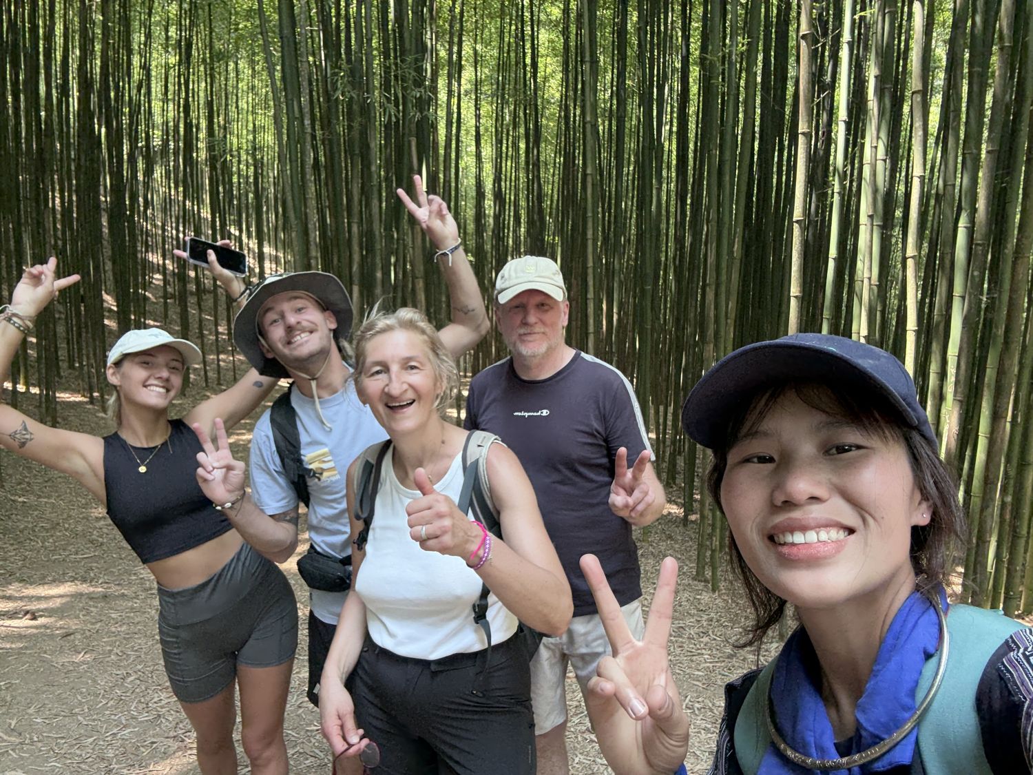 Guests and Bla laughing in the bamboo forest