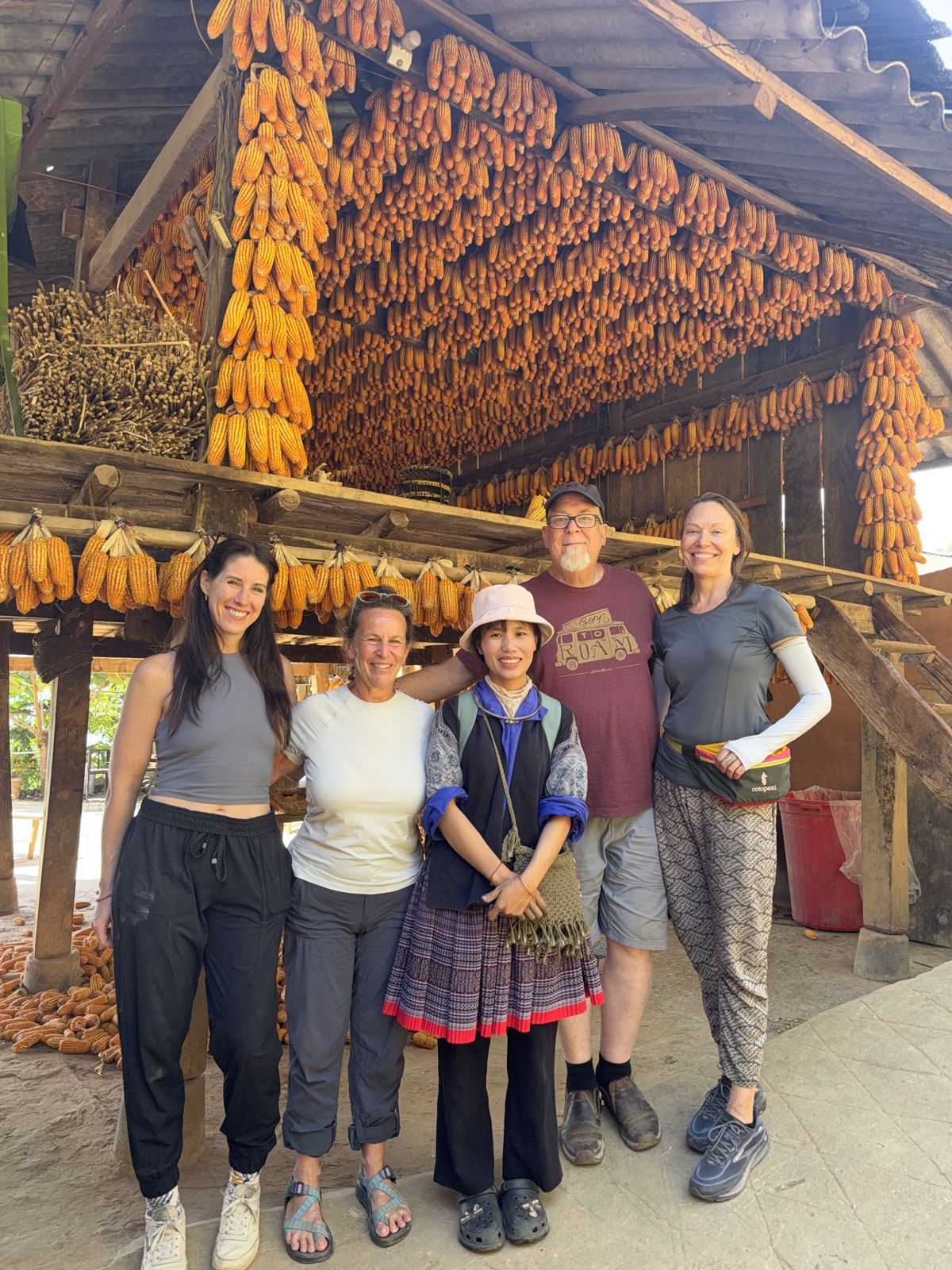 Guests and their guide under the hanging corn